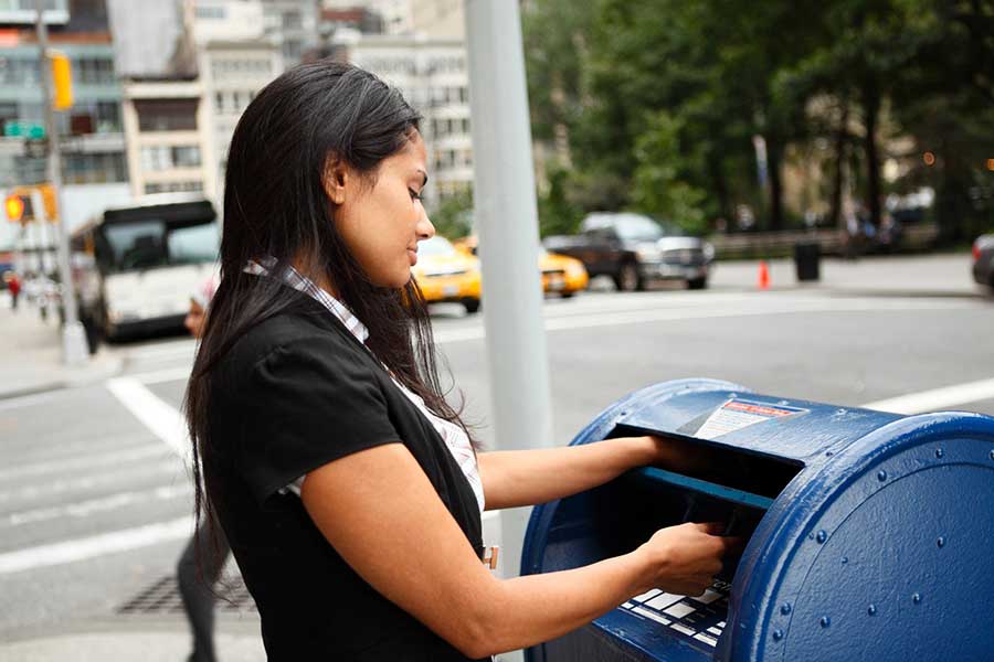 woman mailing a letter