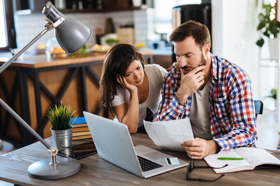 couple looking at bills