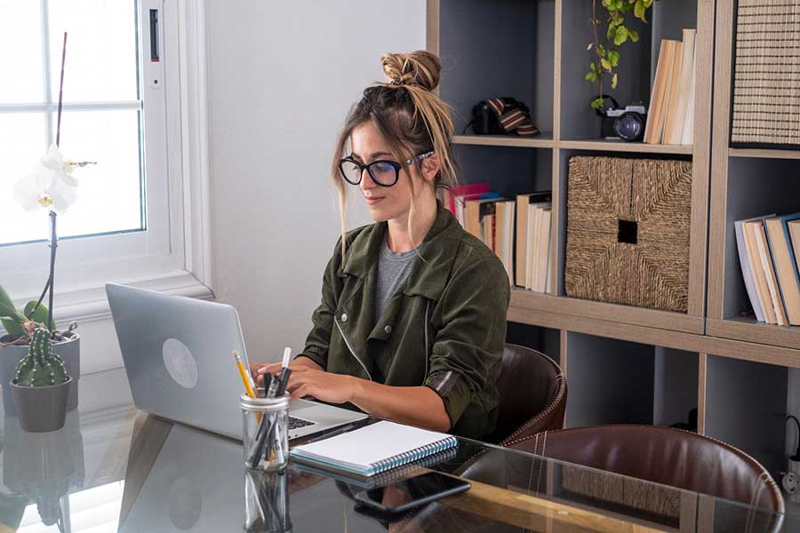 woman typing on laptop