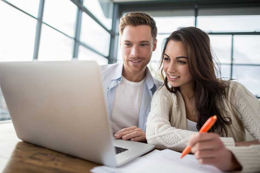 couple reviewing companies online