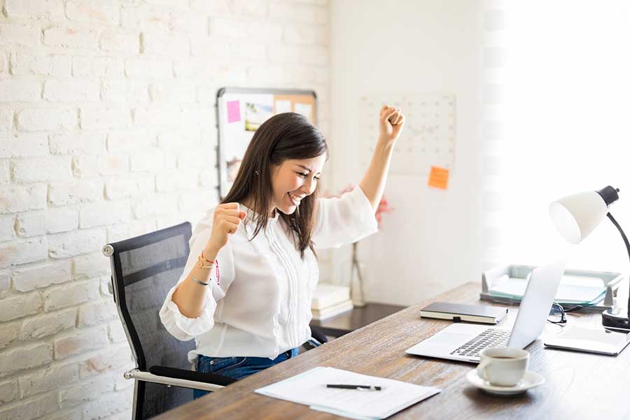 happy woman after fixing her credit